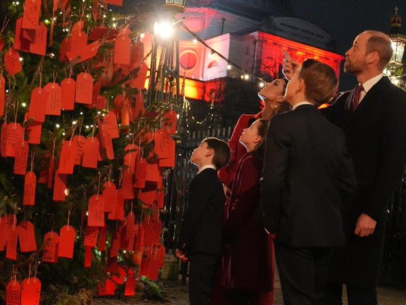 Prince Louis Holds Sweet Note To Granny And Grandpa At Carol Concert