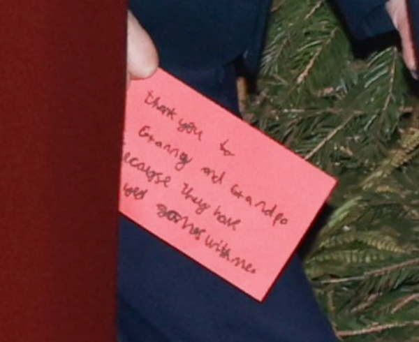 The sweet words on the card held by Prince Louis as he walks into Westminster Abbey