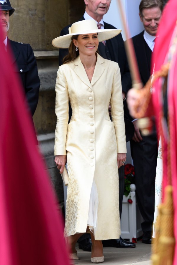Catherine Princess of Wales curtsies at The King and Queen pass on their way to St Georges Chapel