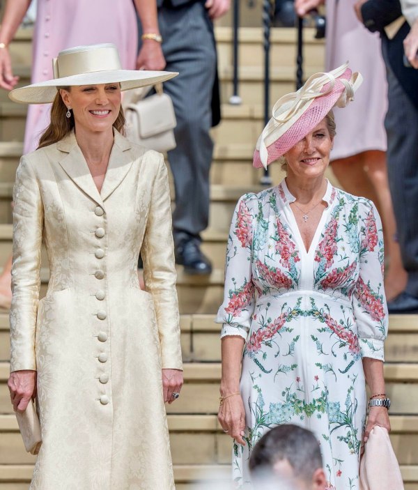 The Duchess of Edinburgh and The Princess of Waleses curtsy as The King and Queen pass by them
