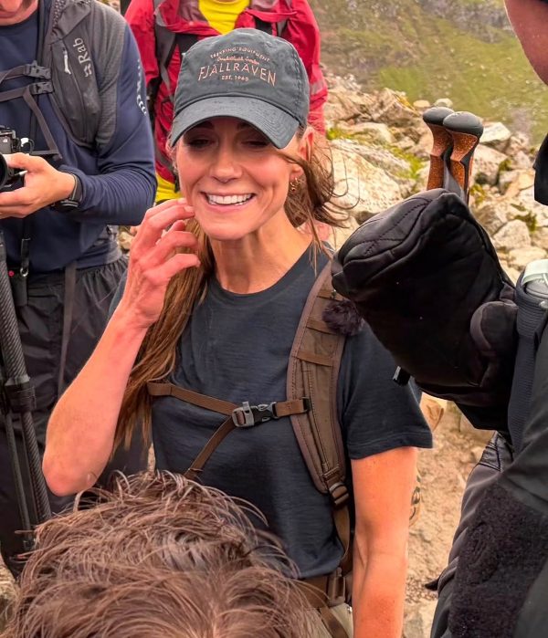 Catherine speaking to other climbers at the summit of Ben Nevis