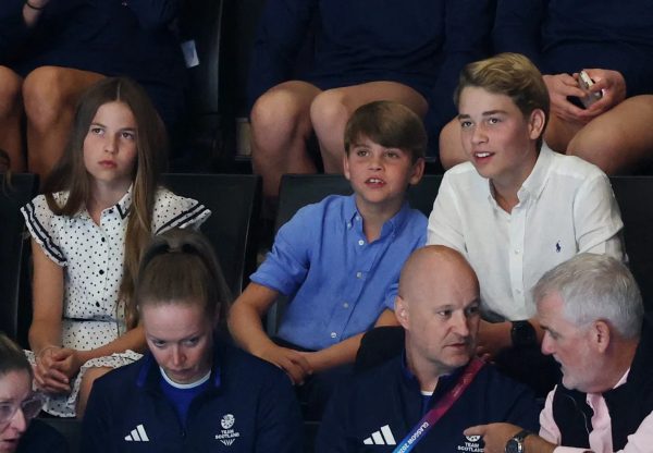 Princess Charlotte, Prince Louis and Prince George sat beside each other for the netball